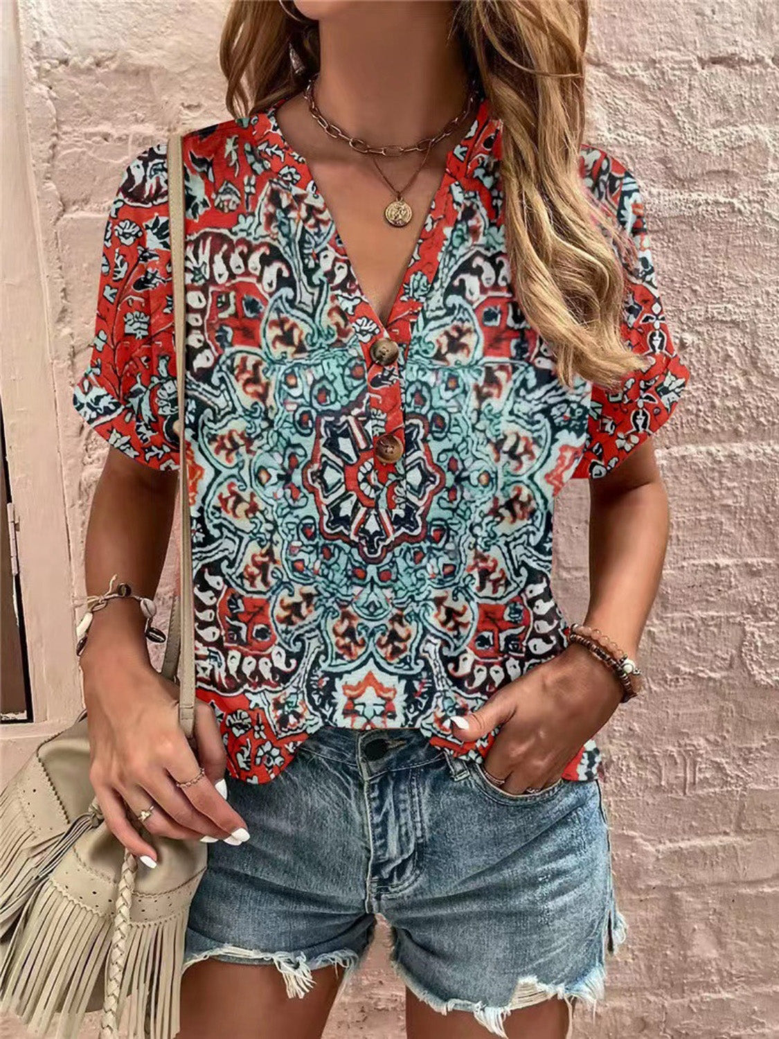 Americana Henley print top with button detail and short sleeves, featuring a red and blue mandala pattern.