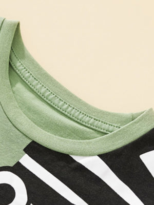 Toddler tee with green neckline and black & white zebra print detail.