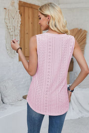 Blush pink sleeveless top with allover eyelet perforations and a curved hem.