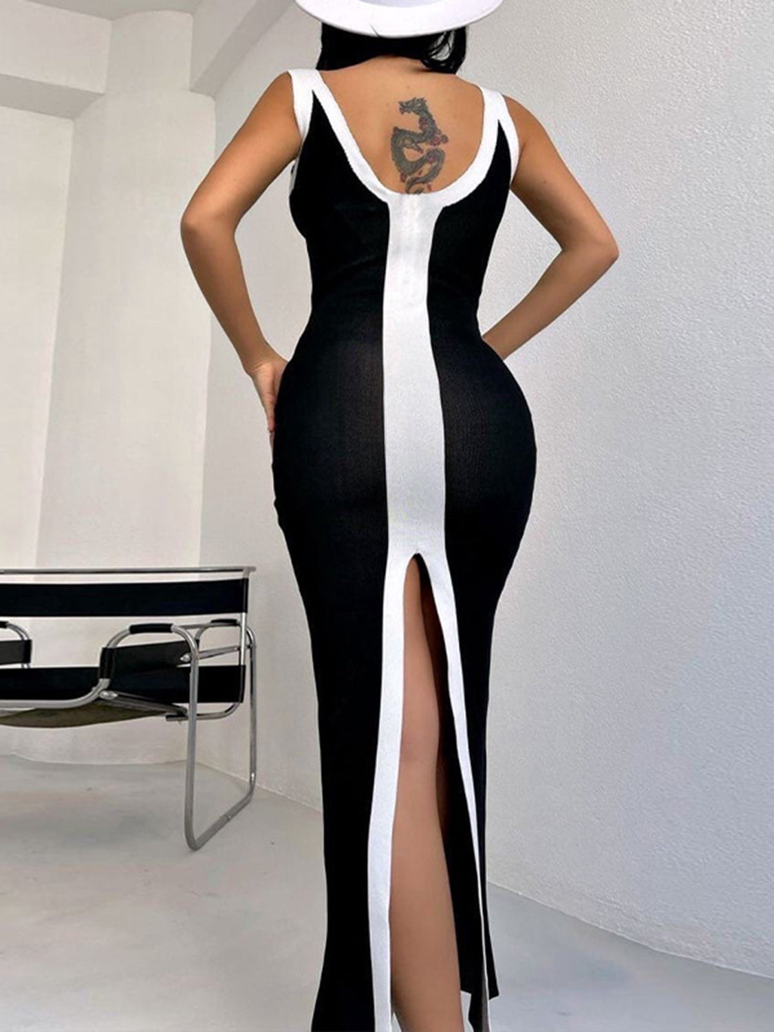 Black and white contrast panel bodycon maxi dress with a thigh-high slit.