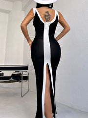 Black and white contrast panel bodycon maxi dress with a thigh-high slit.