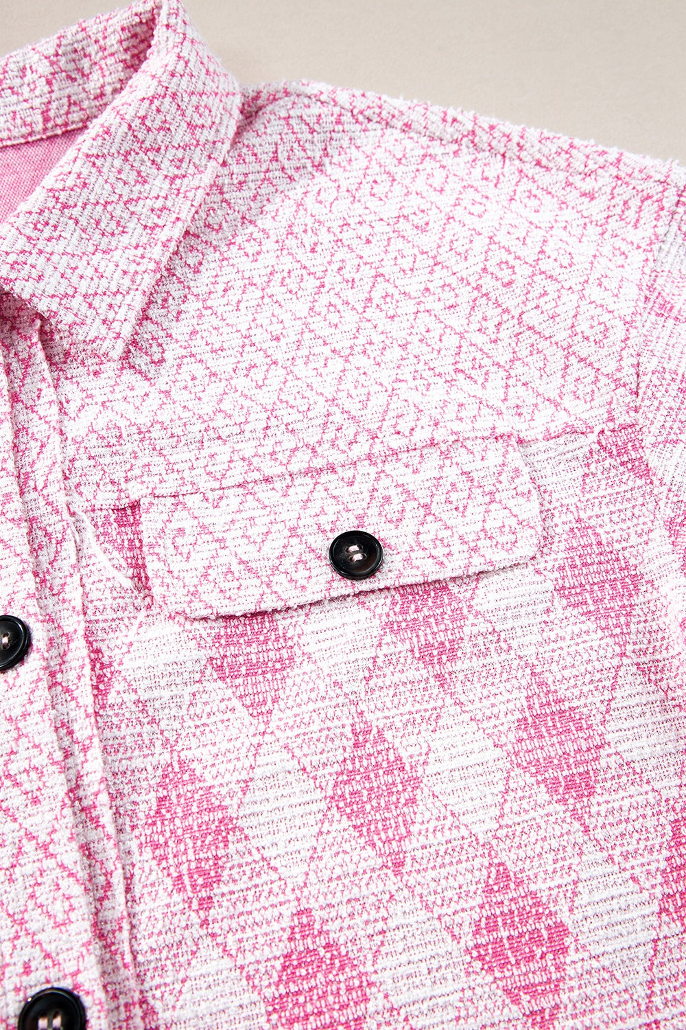 Pink diamond weave shacket with buttoned pockets and collar detail.