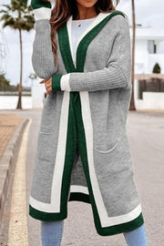 Color-blocked hooded knit maxi cardigan in gray with green and white trim, featuring pockets.