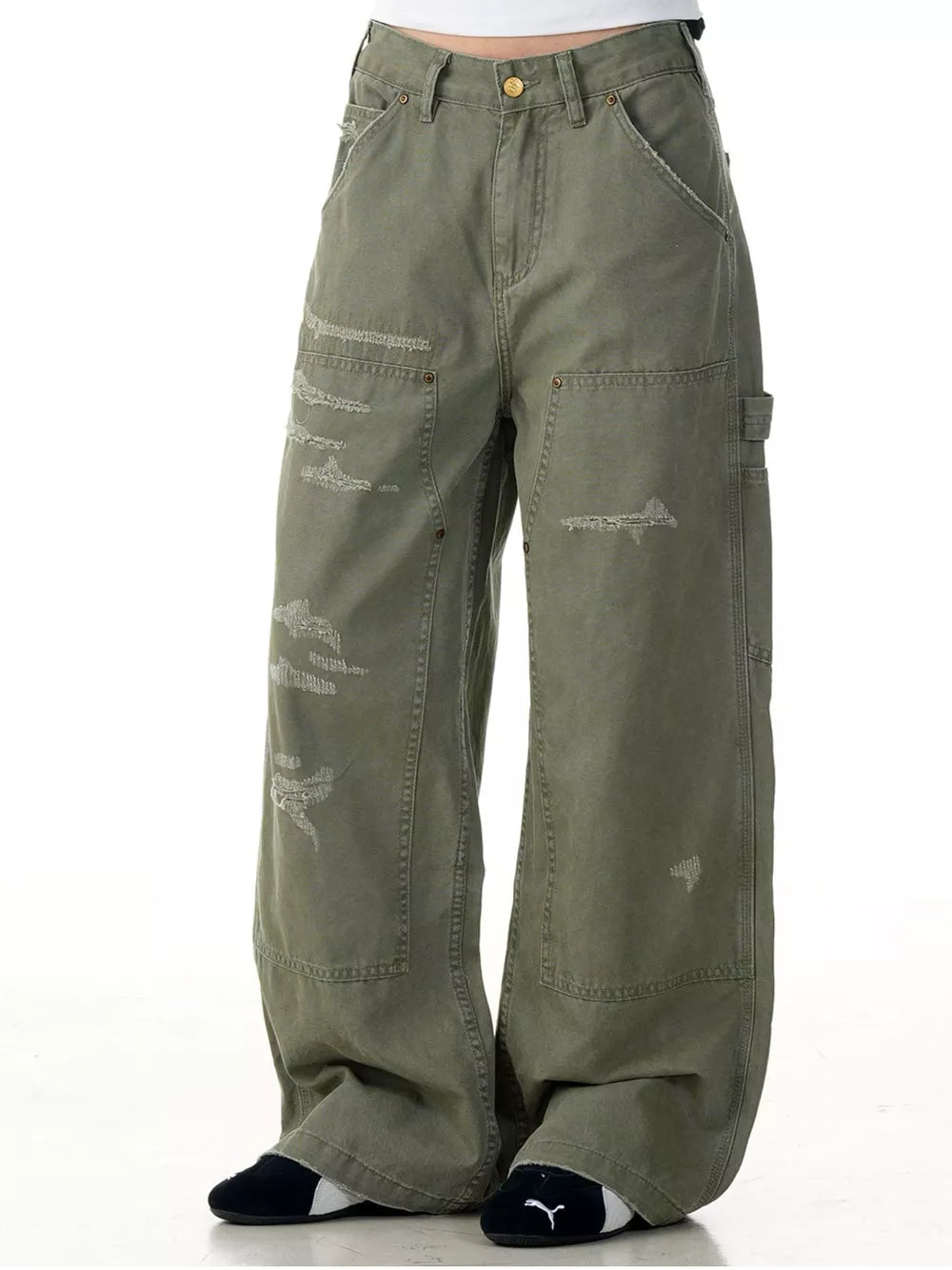 Distressed wide-leg carpenter pants in olive green with a relaxed fit and utility pockets.