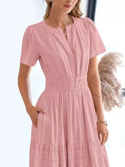 Dusty Pink tiered midi dress with V-neck, short sleeves, and ruched waist.