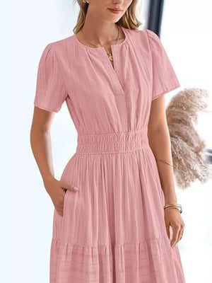 Dusty Pink tiered midi dress with V-neck, short sleeves, and ruched waist.