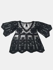 Black embroidered crochet kaftan cover-up with bell sleeves and V-neckline.