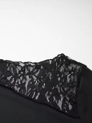 Black maternity tee with asymmetrical lace detail on shoulder and sleeve