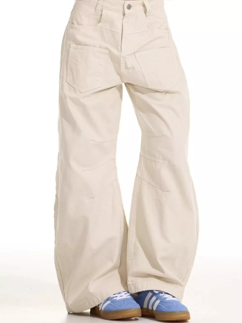 Men's wide-leg sweatpants in beige cotton with multiple pockets and a relaxed fit.