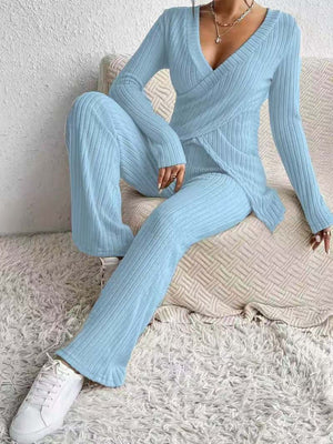 Pastel blue ribbed knit lounge set with crossover V-neck top and wide-leg pants.