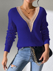 Dark blue knit sweater with lace trim V-neck and openwork sleeves.