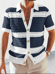 Navy and white striped crochet polo shirt with short sleeves and a button-up front.