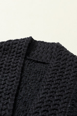 Black textured bouclé knit bolero jacket detail