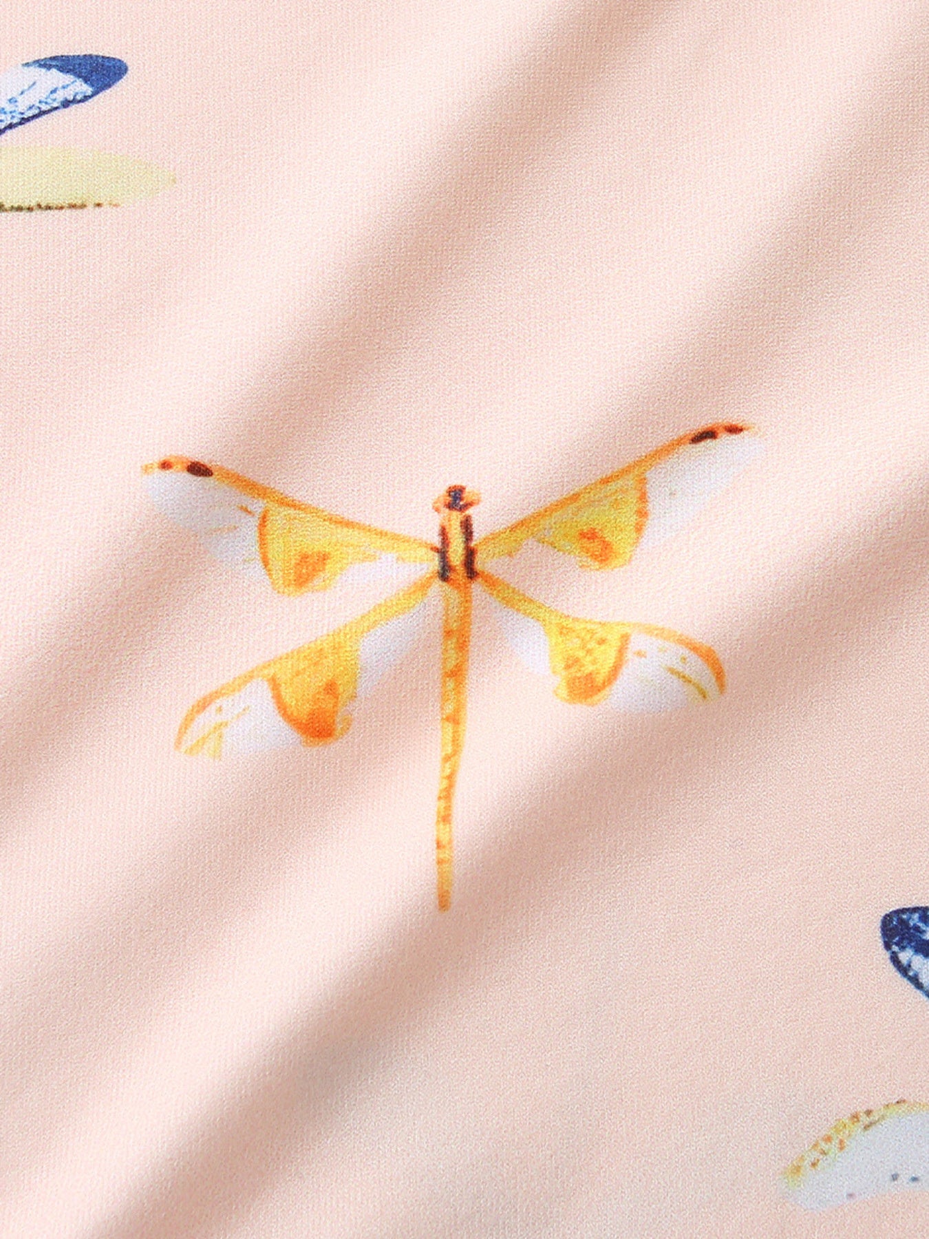 Toddler underwear with a pink base and a yellow dragonfly print.
