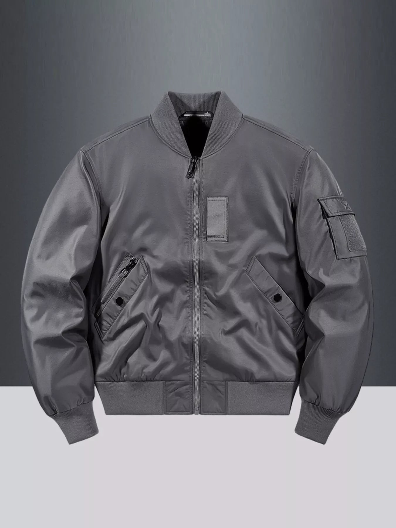 Gray bomber jacket with zip front, ribbed collar, cuffs, and hem, and utility pocket.