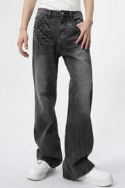 Washed black wide-leg denim jeans with a relaxed fit and subtle distressed detailing.