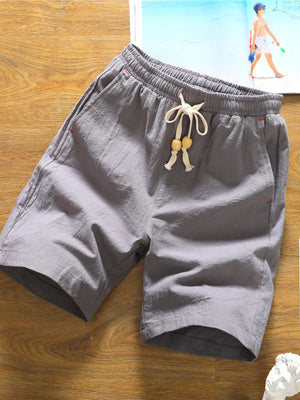 Grey relaxed fit chino shorts with drawstring and wooden beads, casual summer style