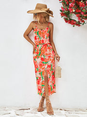 Red-Violet floral print midi dress with spaghetti straps, button front, drawstring waist, and thigh slit.
