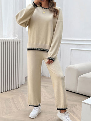 Beige knit lounge set with ribbed trim on crewneck, cuffs, and hem.