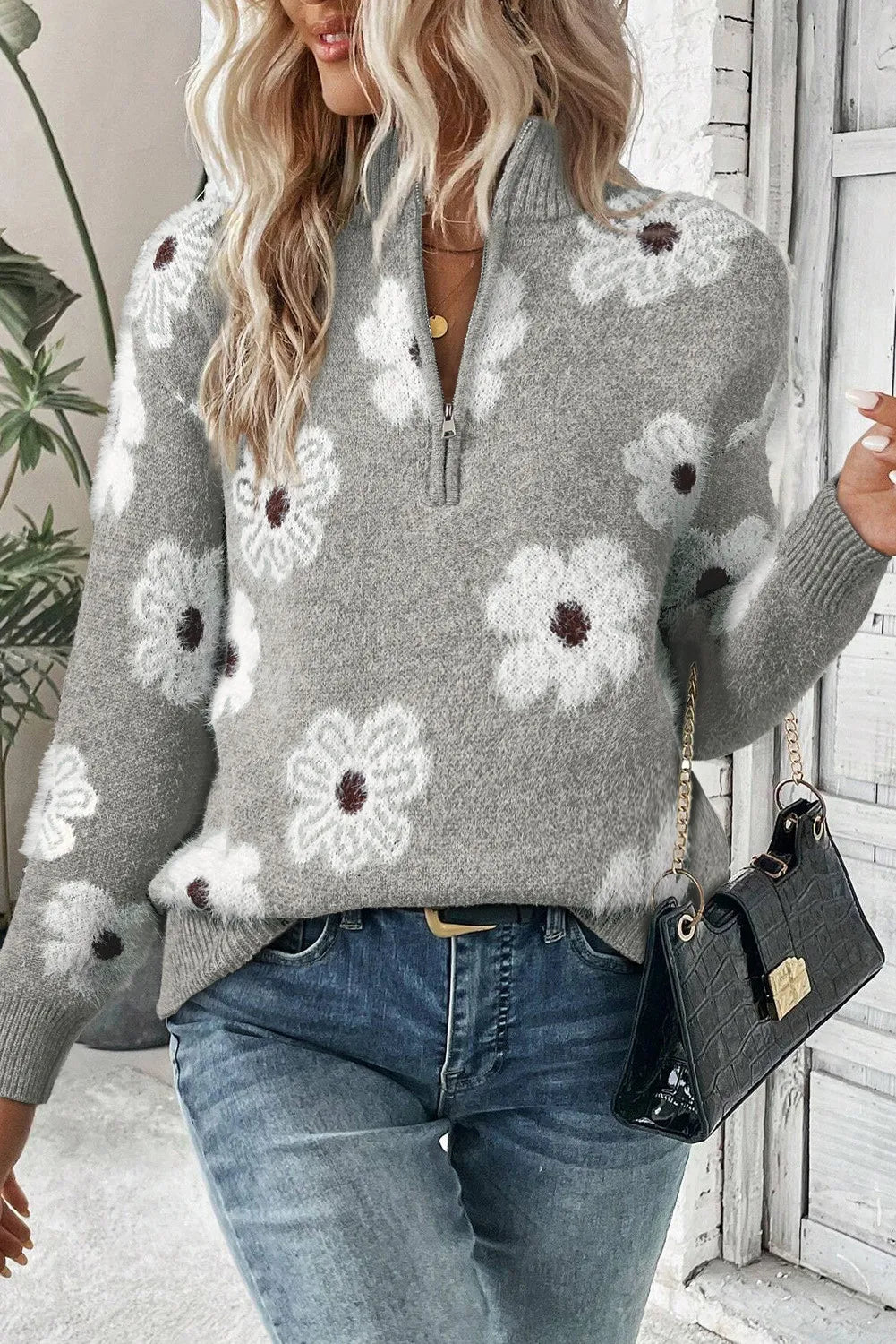 Gray floral intarsia mock neck sweater with quarter zip and fuzzy texture.