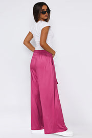 Hot Pink wide-leg flow pants with self-tie belt and pockets.