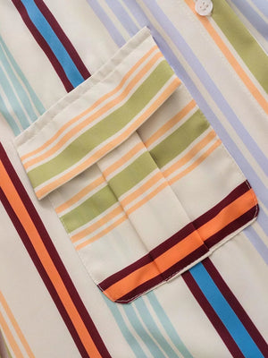 Prismatic stripe band collar blouse with buttoned pocket detail.