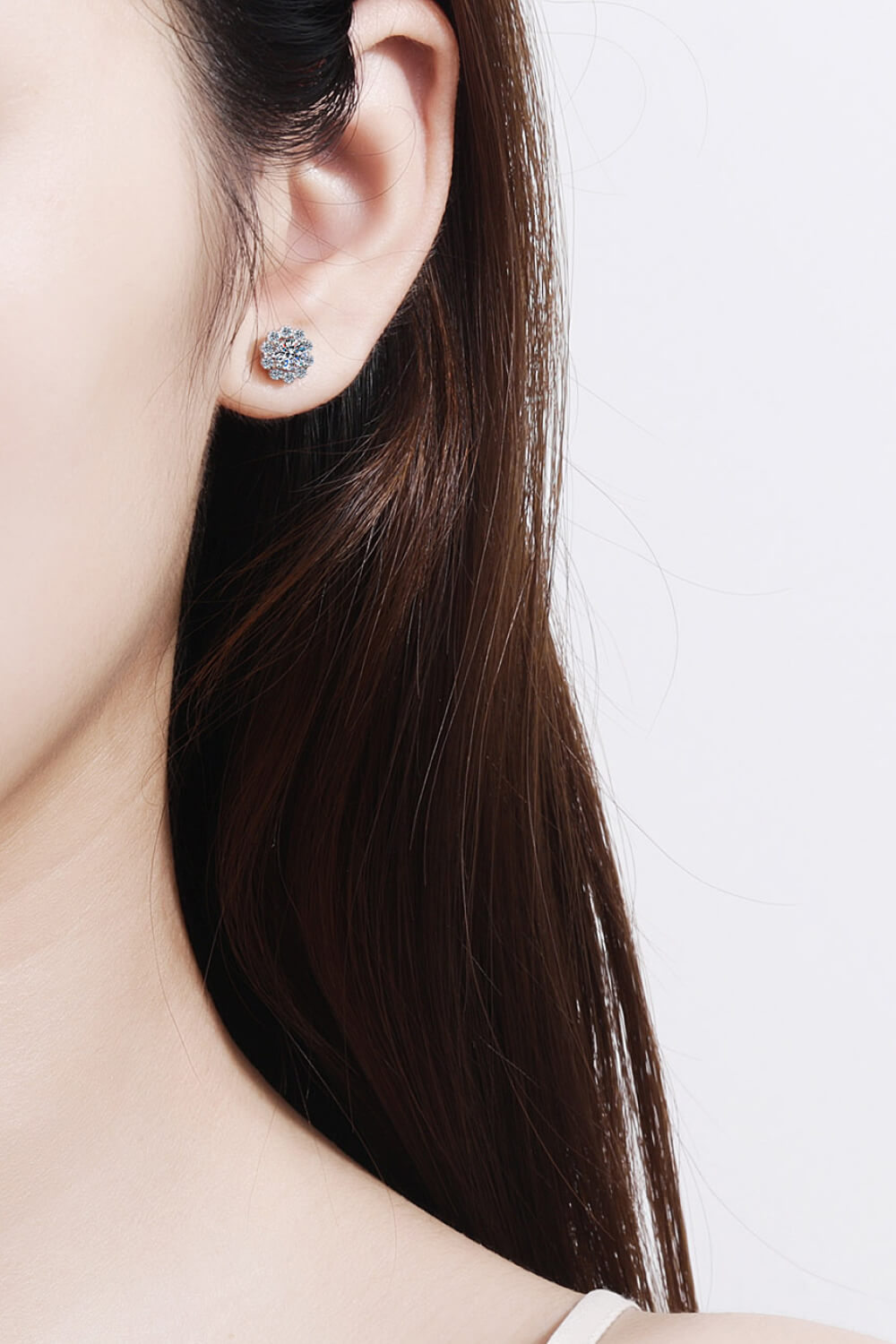 Floral halo stud earrings in silver 925 sterling silver with a blossom design.