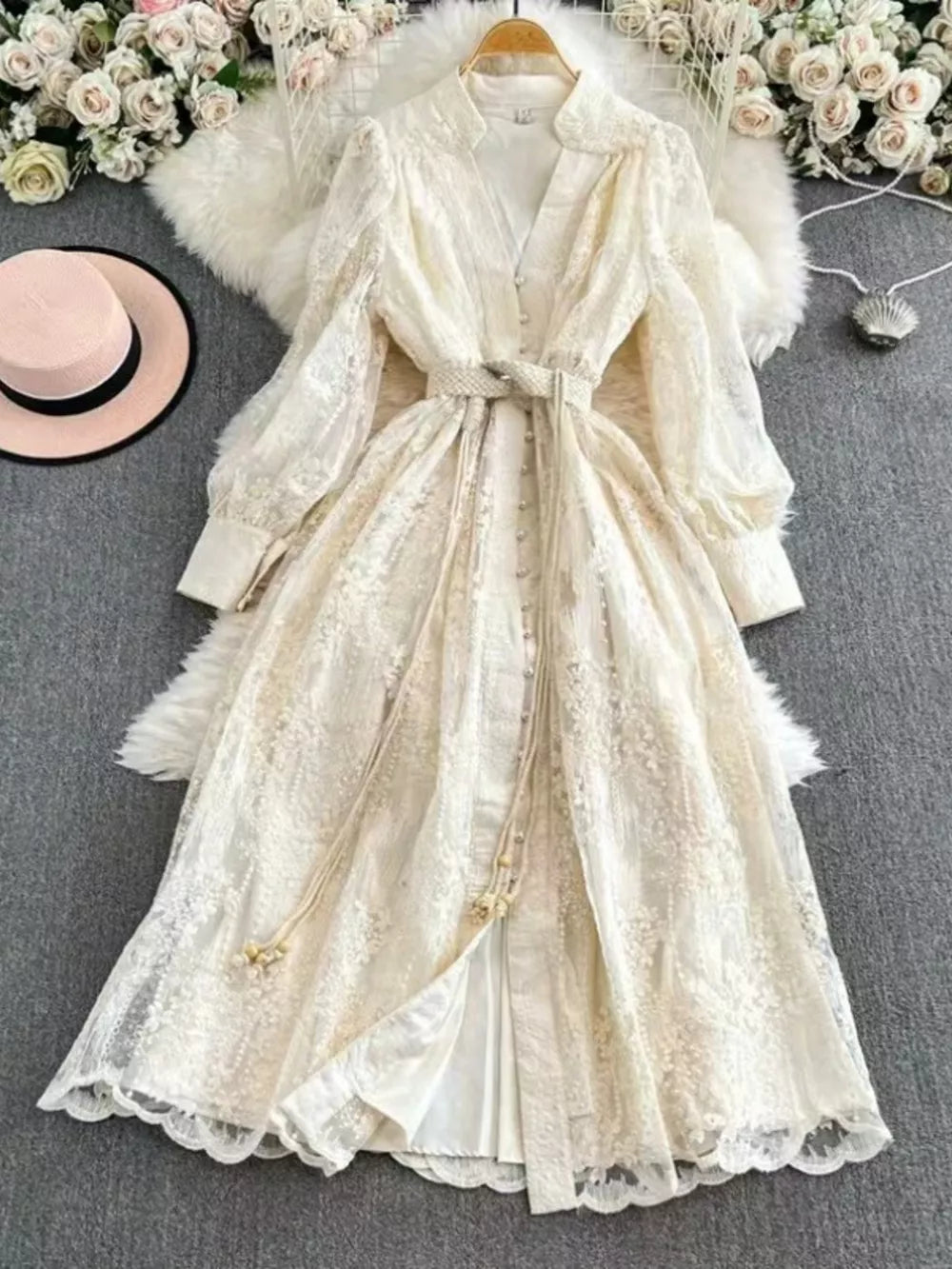 Lace maxi dress with tie waist, balloon sleeves, and button-down front in apricot.