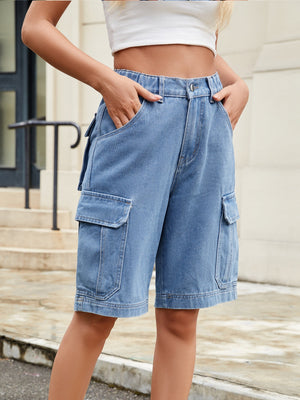 Medium wash denim cargo bermuda shorts with elastic waist and utility pockets.