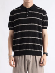 Black striped knit polo shirt with button accents and short sleeves.