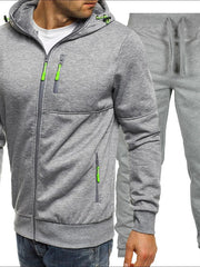 Gray tech-inspired zip-up hoodie with neon green zipper details and matching track pants.