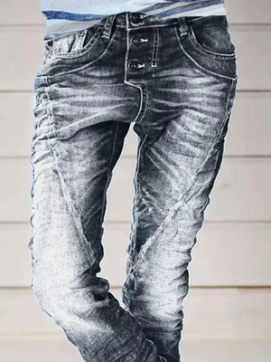 Grey cuffed button-fly jeans with distressed detailing and contrast stitching.