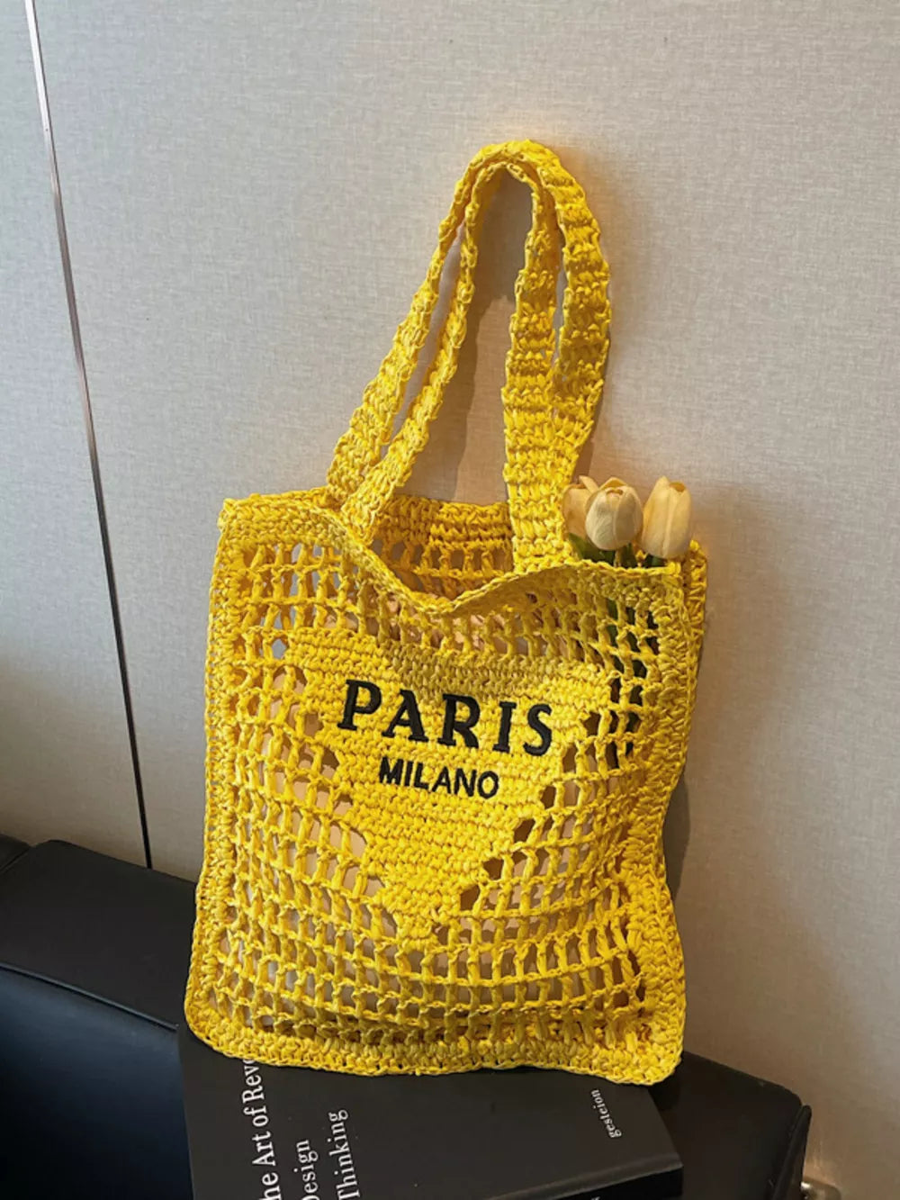 Yellow crochet tote bag with PARIS MILANO print and double straps.