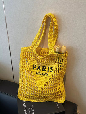 Yellow crochet tote bag with PARIS MILANO print and double straps.
