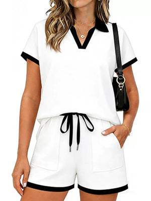 White polo collar two-piece set with black trim and drawstring shorts.