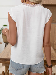 White maternity blouse with lace V-neck detail and cap sleeves