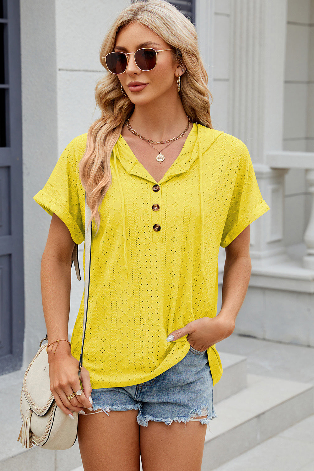 Yellow perforated henley hooded tee with short sleeves and button detail