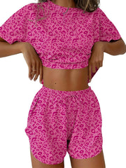 Pink leopard print pajama set with drawstring shorts and cropped t-shirt