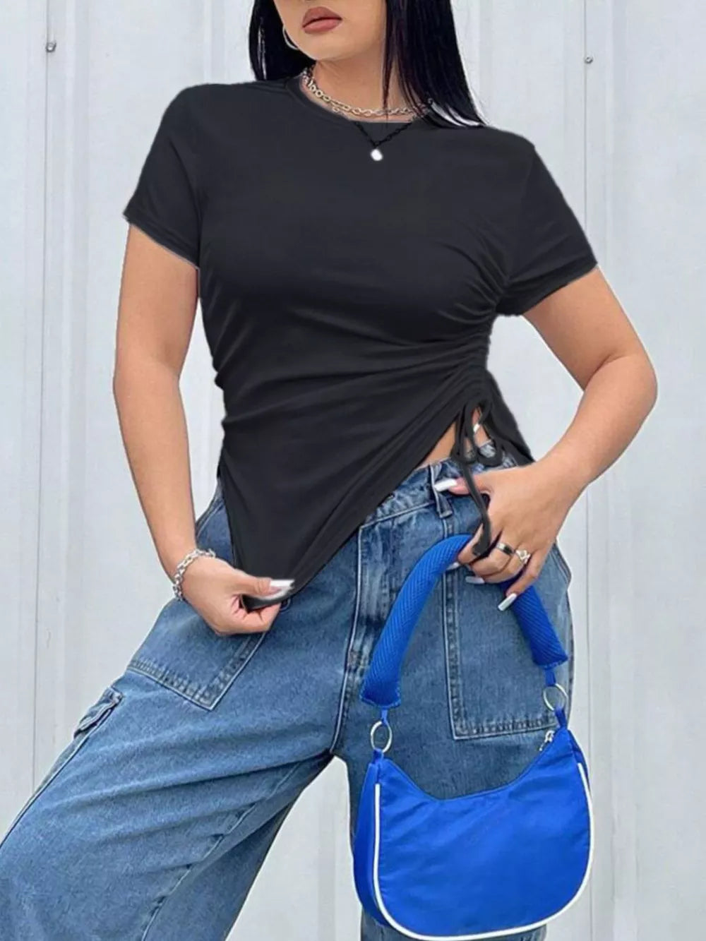 Black asymmetrical ruched t-shirt with short sleeves and a crew neck.