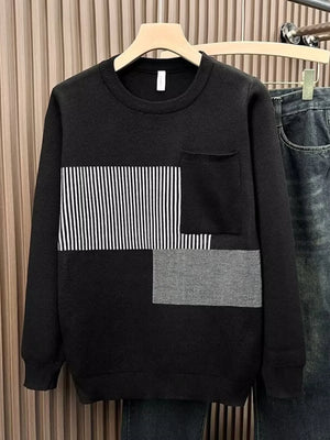 Men's black long sleeve sweater with striped and textured block details and a chest pocket.