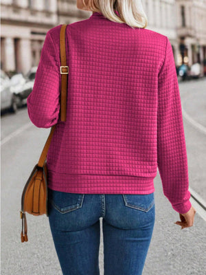 Deep Rose quilted bomber jacket with zip closure and long sleeves.