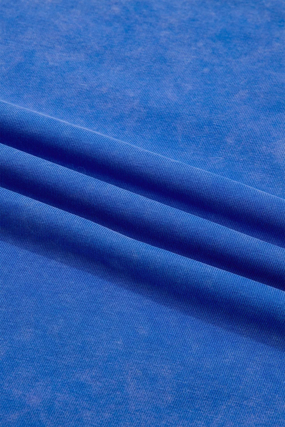 Blue cotton t-shirt with a washed effect and ribbed texture detail.