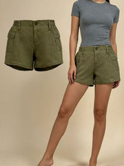 Green cargo shorts with elastic waist and button fly, featuring multiple pockets.
