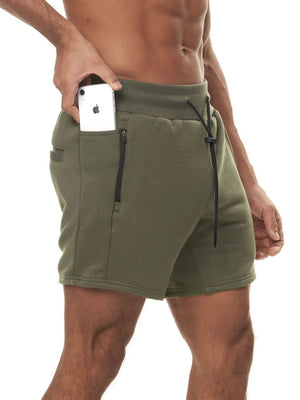 Army green fleece jogger shorts with drawcord and zip pocket detail.