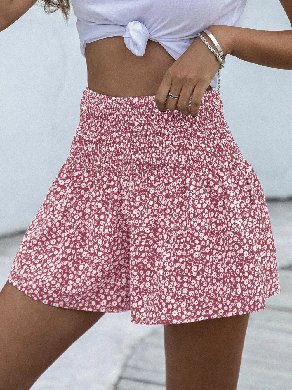 Red floral chino shorts with elastic waist and a flowy fit.