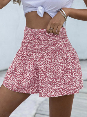 Red floral chino shorts with elastic waist and a flowy fit.