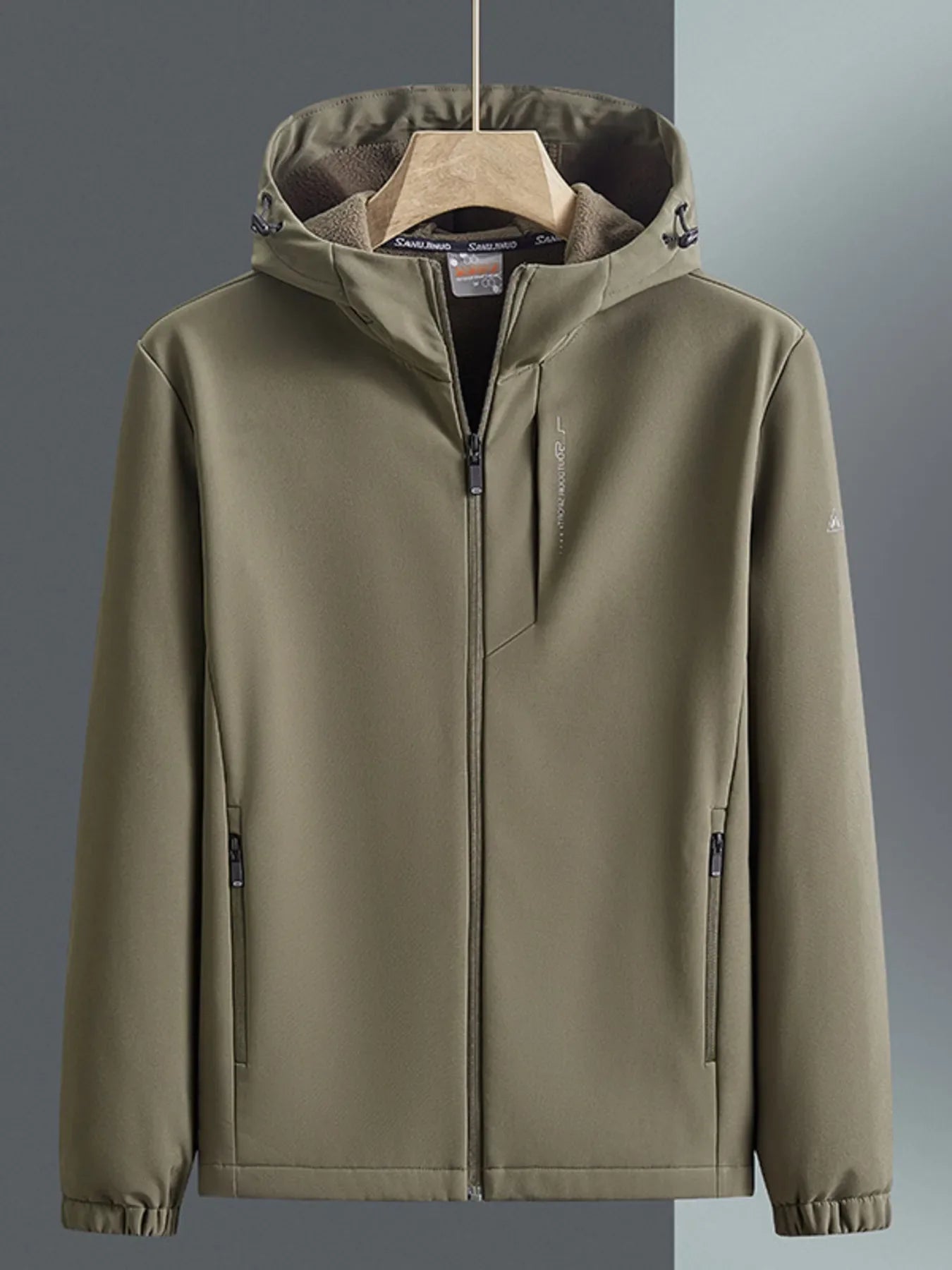 Khaki hooded windbreaker jacket with zippered pockets and fleece-lined hood.