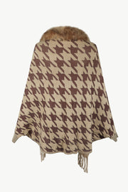 Houndstooth faux fur collar poncho in beige with brown pattern and fringe detail.