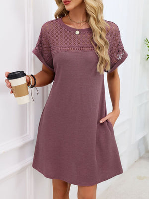 Mauve t-shirt dress with sheer lace yoke and short sleeves, above knee length.