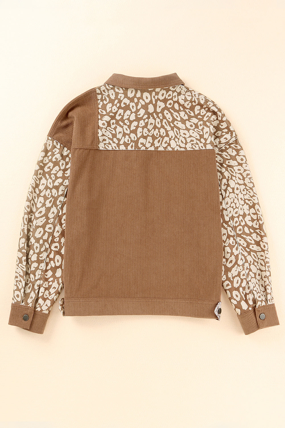 Camel corduroy jacket with leopard print panels on sleeves and yoke, buttoned cuffs.